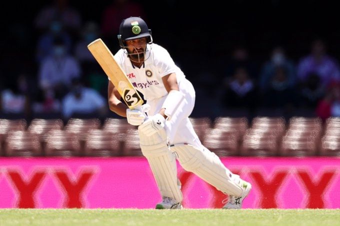 Pujara scores half century