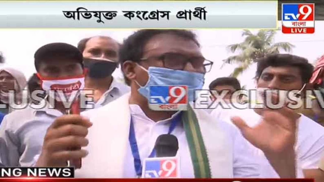 West Bengal Election 2021 Phase 7: লাইনে দাঁড়িয়ে মাস্ক দিচ্ছেন প্রার্থী, তুমুল উত্তেজনা মুর্শিদাবাদে