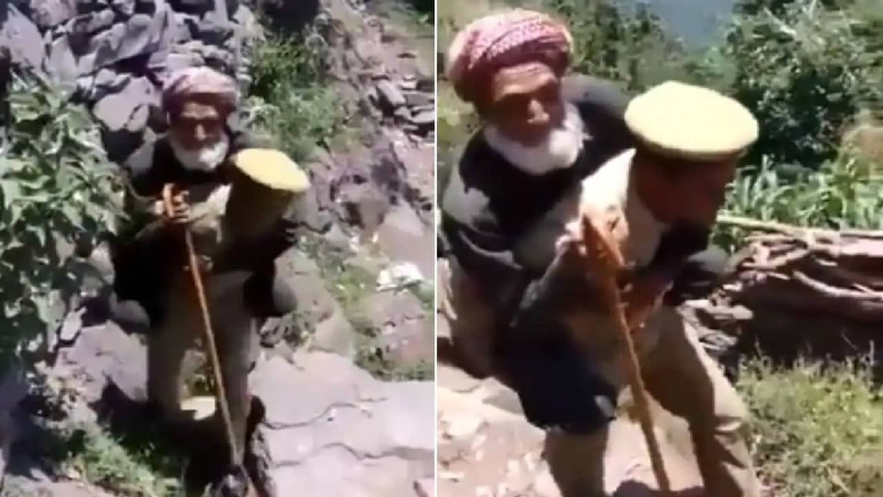 পাহাড়ি রাস্তায় বৃদ্ধকে কাঁধে চাপিয়ে ভ্যাকসিন কেন্দ্রে নিয়ে গেলেন পুলিশ