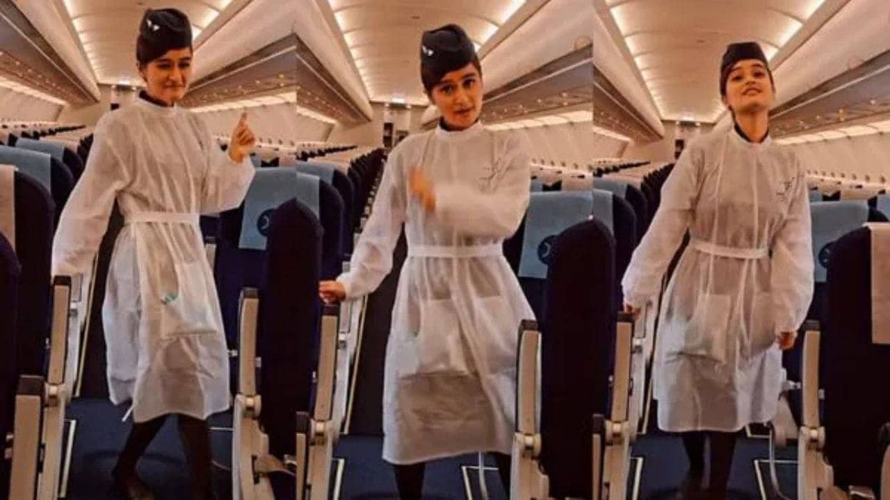 Viral Video: মানিকে মাগে হিথে গানে পিপিই কিট পরে নাচলেন এয়ার হোস্টেস!