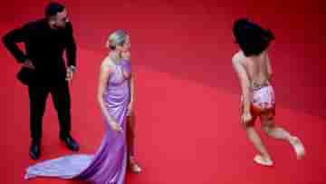 Cannes Red Carpet: ধর্ষণ করা বন্ধ হোক! অর্ধনগ্ন তরুণীর প্রতিবাদে থমকে গেল কানের রেড কার্পেট