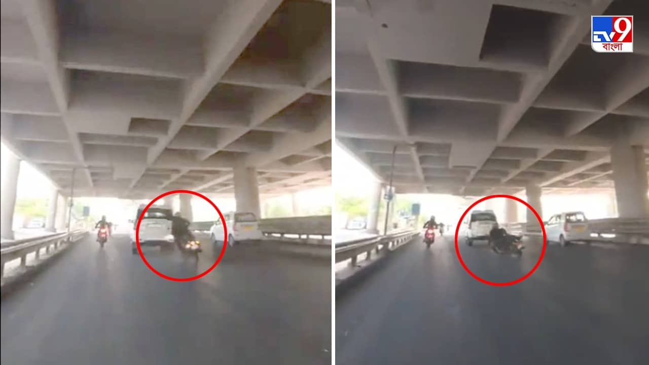 Delhi Accident Viral Video: দিল্লির মাঝ রাস্তাতে ঝগড়া! বাইক চালককে পিষে দেওয়ার চেষ্টা সাদা স্করপিওর, দেখুন ভিডিয়ো