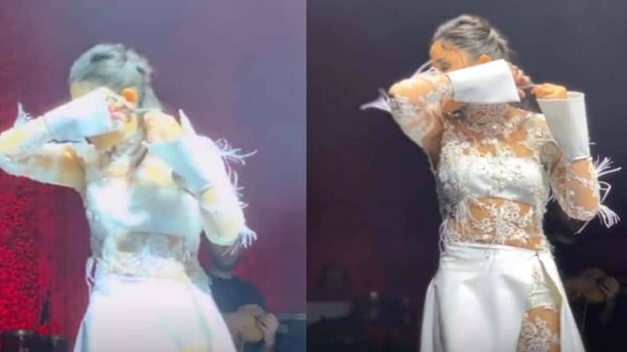 Anti Hijab Protest: হিজাব বিরোধী আন্দোলনে সমর্থন, অনুষ্ঠান মঞ্চেই নিজের চুল কাটলেন গায়িকা