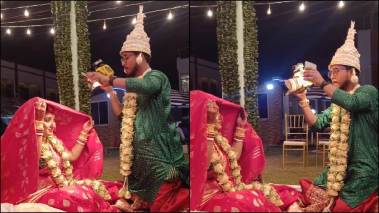 Viral Video: নিজের বিয়েতেও ছাড় নেই ওয়েডিং ফটোগ্রাফারের, সেই ক্যামেরা হাতে বউয়ের ছবি তুলতে হল