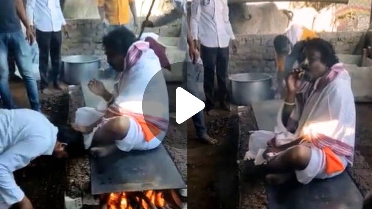 Viral Video: স্টোভের উপরে বসে বাবাজি! বিড়িতে সুখটান দিতে দিতে ভক্তদের আশীর্বাদ করছেন...