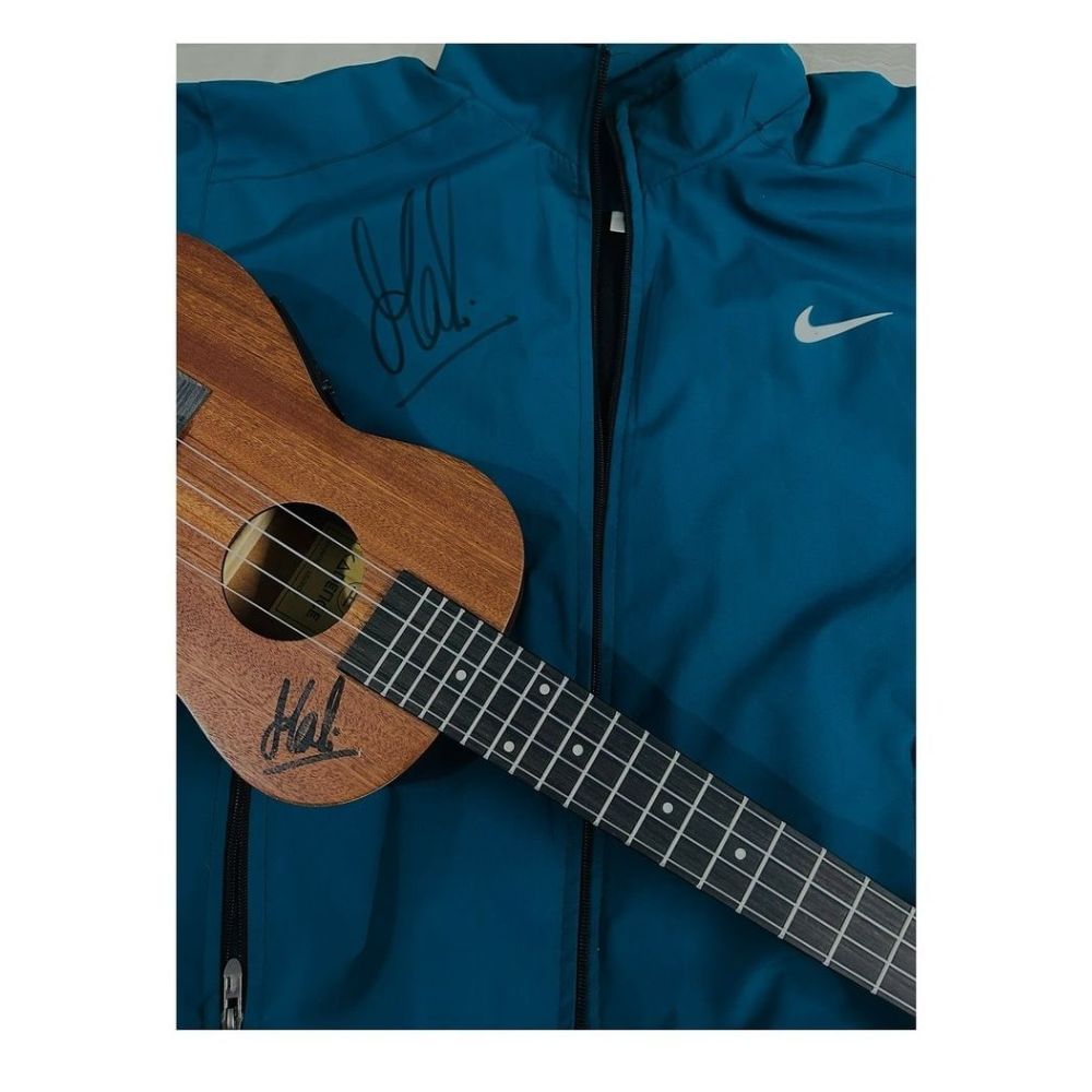 MSD give autograph to his fan in shirt and guitar
