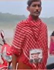 গলায় ছবি ঝুলিয়ে তর্পণ জুবিন ভক্তের